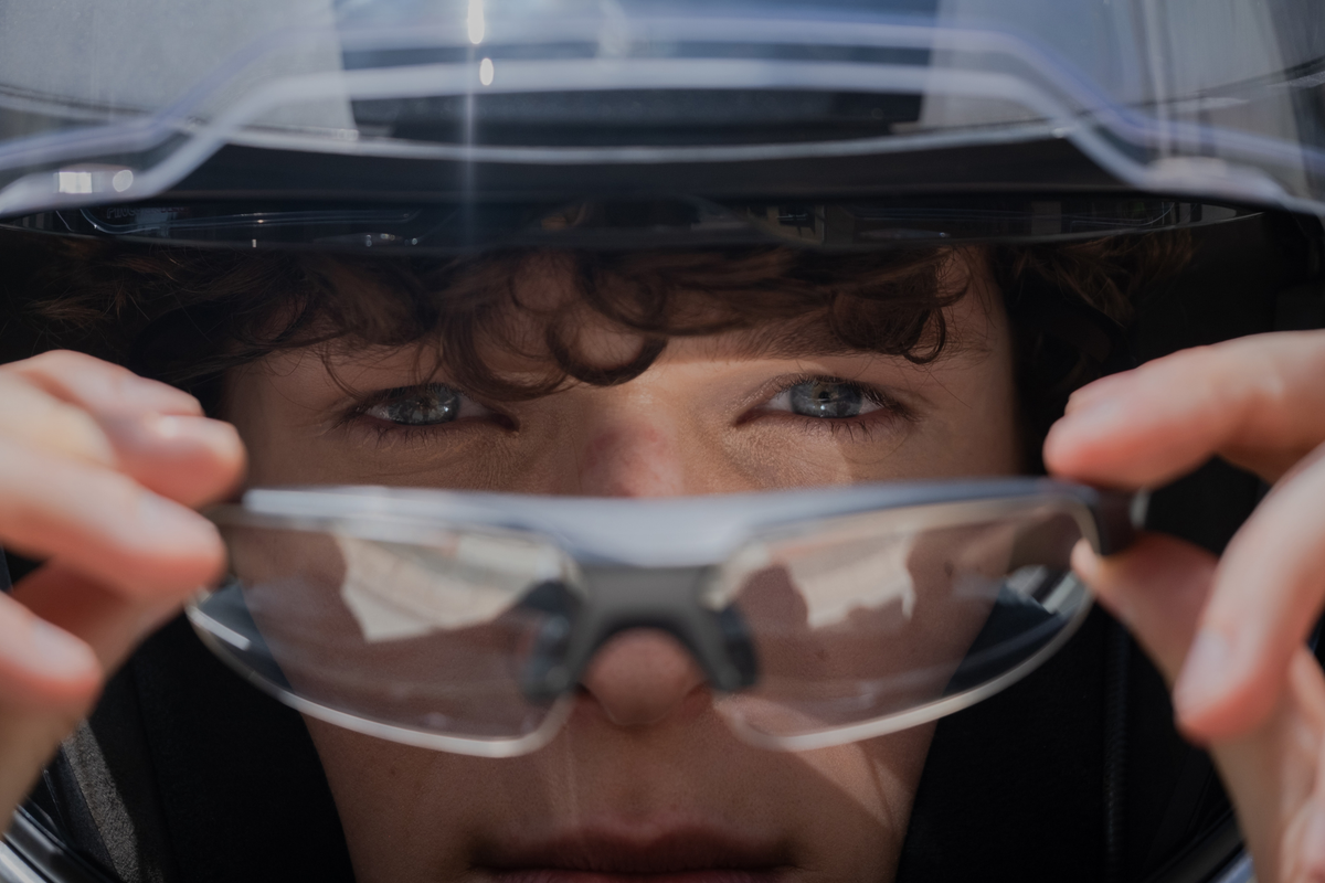 Man putting on Maverick Sport Glasses