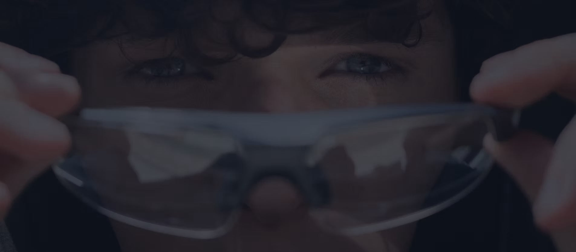 Man putting on Maverick Glasses